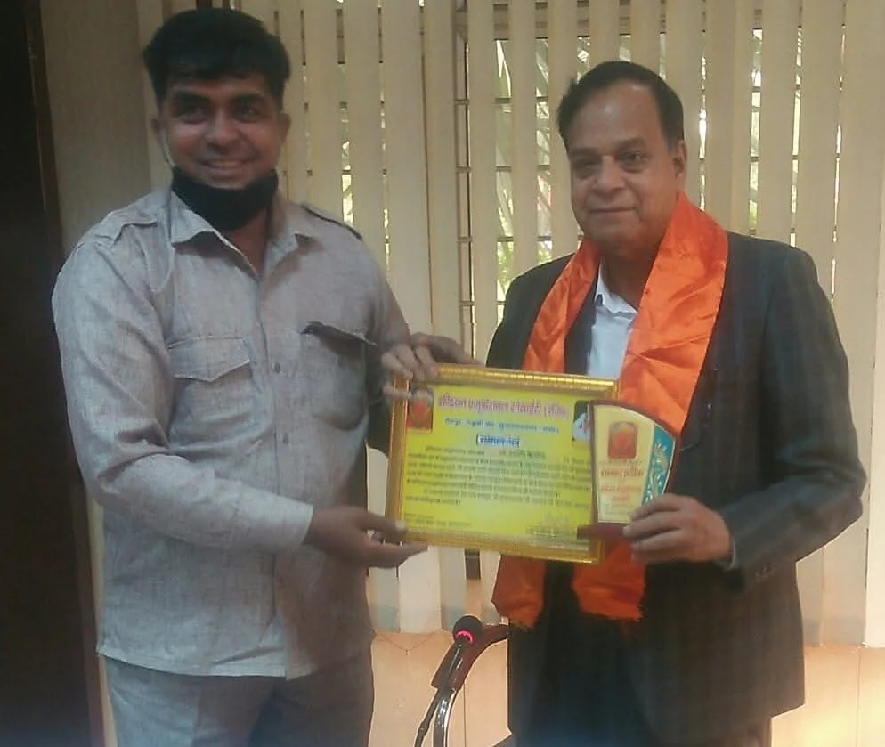 Indian Educational Society award presentation at speaker podium