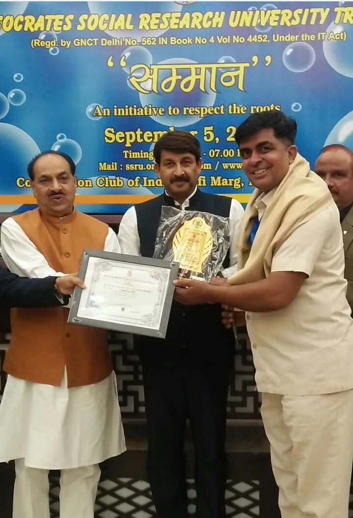 MP Manoj Tiwari presenting Socrates Social Research University Samman award