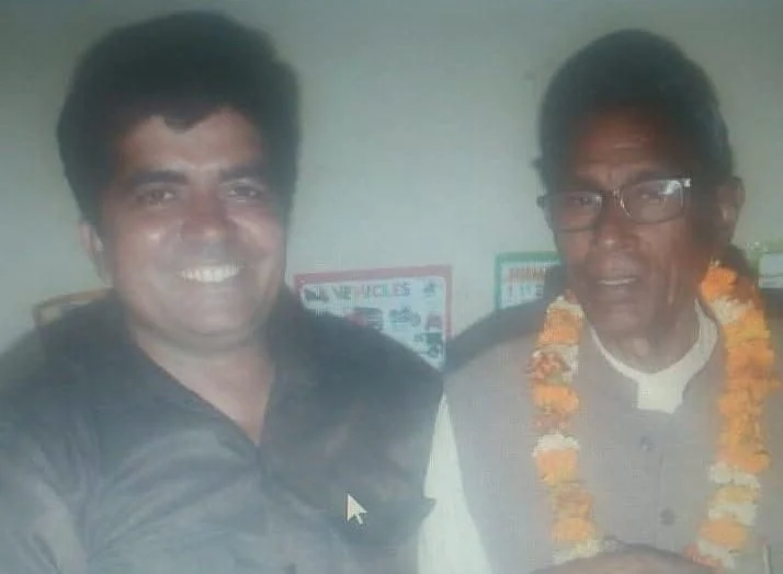 Dr. Avadhesh Kaushik with a community elder